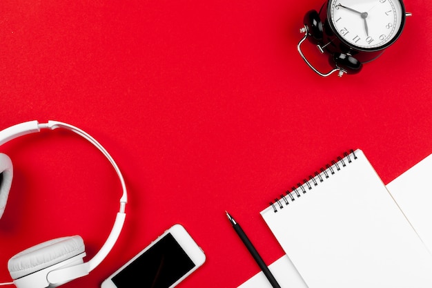 Headphones with cord on red and white color 