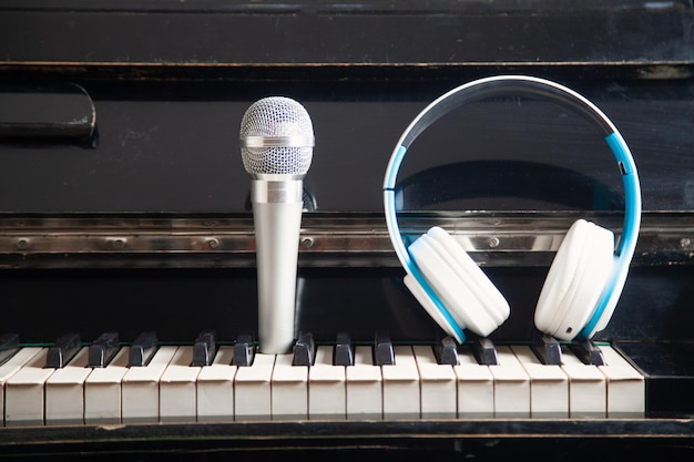 Headphones with a microphone on the piano keyboard Music