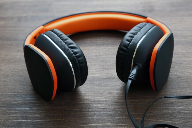 Headphones on wooden background