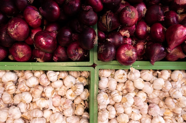 Heads of garlic on bottom and purple onions