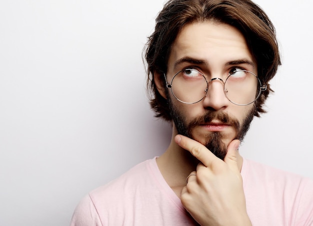 Headshot of satisfied cheerful man wearing glasses glad to find suitable well paid job