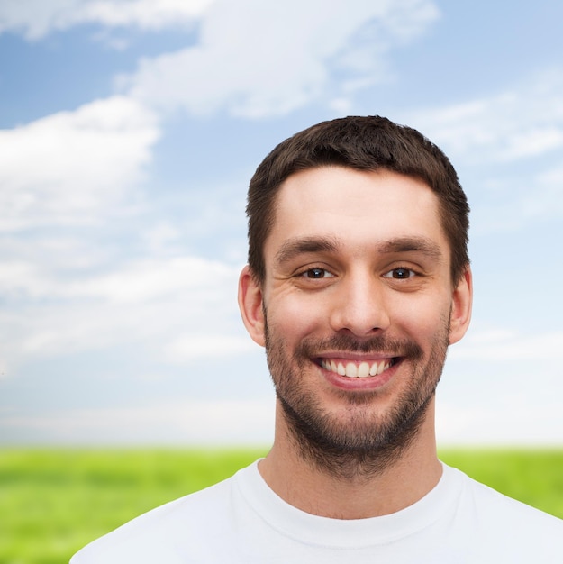 health and beauty concept - portrait of smiling young handsome man