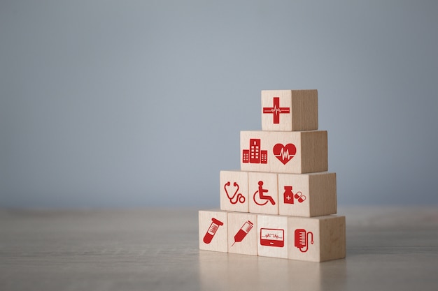 Health Insurance Concept,arranging wood block stacking with icon healthcare medical.