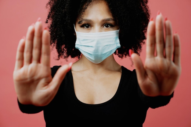 Health protection Shows a stop hand gesture Covid and the woman Medical mask for pandemic