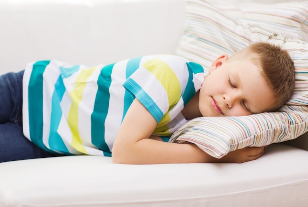 Photo health, sleeping and dreaming concept - little boy sleeping at home