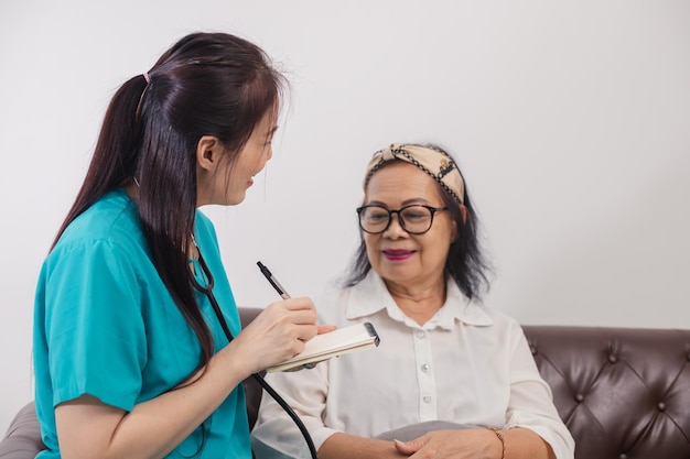 Health visitor and a senior woman during home visit