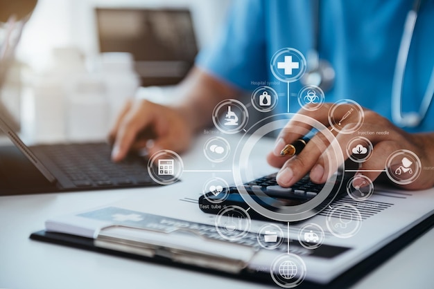 Healthcare costs and fees conceptHand of smart doctor used a calculator for medical costs in modern hospital with VR icon diagram