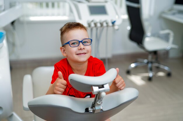 Healthcare little dentist boy tools Child playing with dental equipment