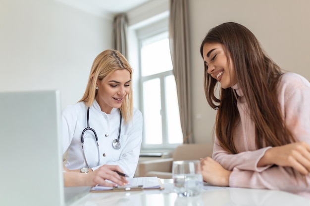 Healthcare and medical concept doctor with patient in hospital Doctor working in the office and listening to the patient she is explaining her symptoms healtcare and assistance concept