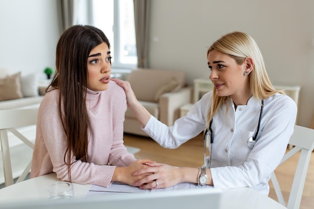 Healthcare and medical concept doctor with patient in hospital Doctor working in the office and listening to the patient she is explaining her symptoms healtcare and assistance concept