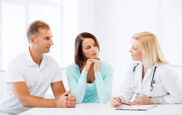 healthcare and medical concept - doctor with patients in cabinet