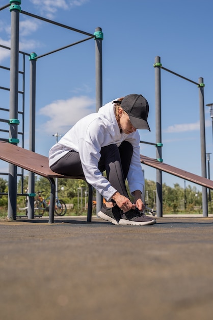 Healthy and active lifestyle. Sports and fitness. Young sportive woman working out on sport ground