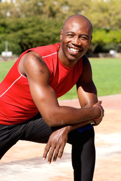 Healthy african guy standing outdoors at the park