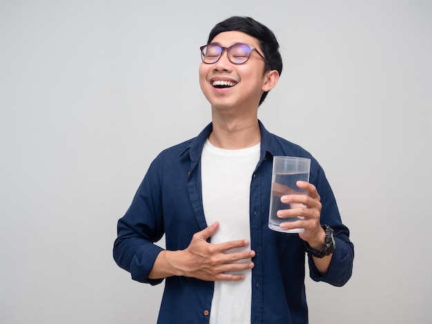 Healthy asian man feels fresh with drinking water in hand isolated