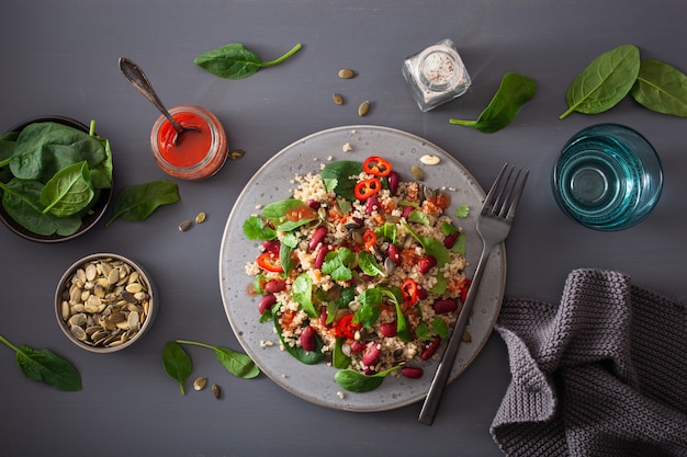 Healthy bean and quinoa salad with spinach, chili