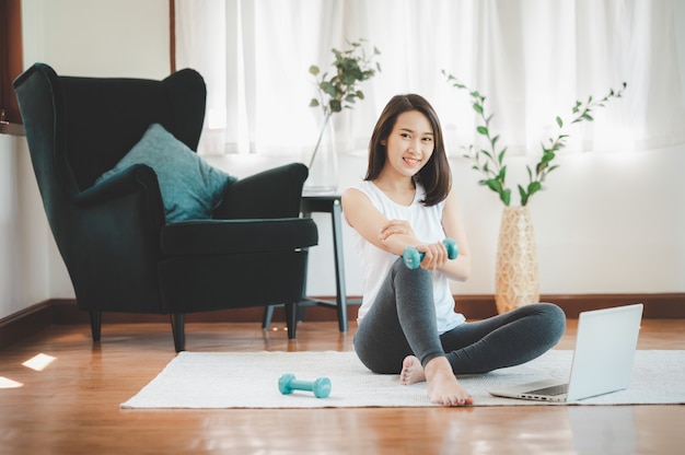 Healthy beautiful Asian woman sitting