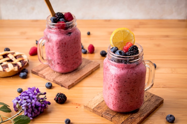 Healthy blueberry smoothies on wooden background