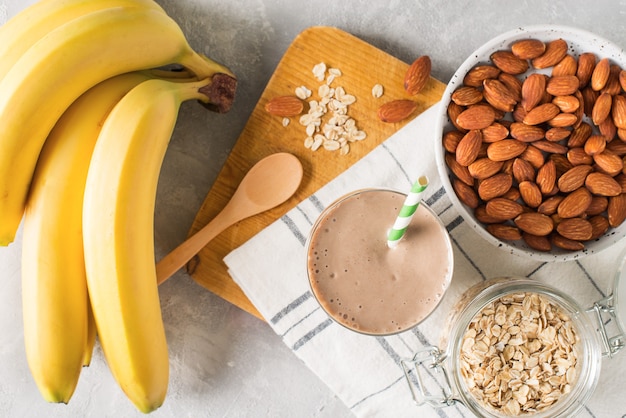 Healthy breakfast  banana oatmeal almond milk on white background