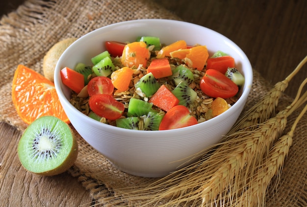 Healthy breakfast in a bowl on wooden floor