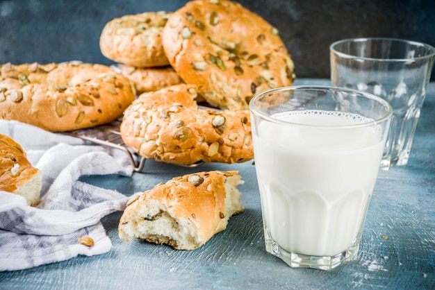 Healthy breakfast concept, home made cereal bagels with milk glass