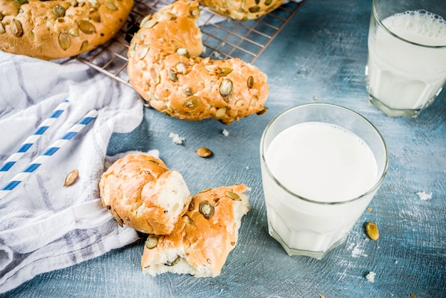 Healthy breakfast concept, home made cereal bagels with milk glass