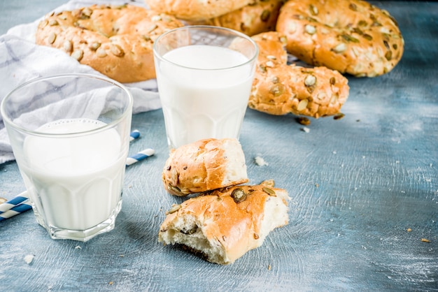 Healthy breakfast concept, home made cereal bagels with milk glass