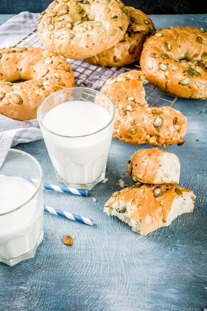 Healthy breakfast concept, home made cereal bagels with milk glass