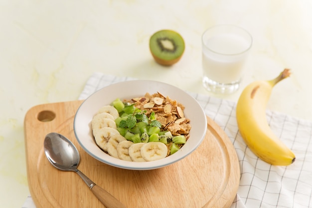 Healthy breakfast: corn flakes with milk and fresh fruits