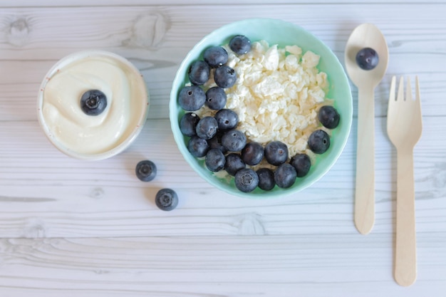 Healthy breakfast Cottage cheese with blueberries top view