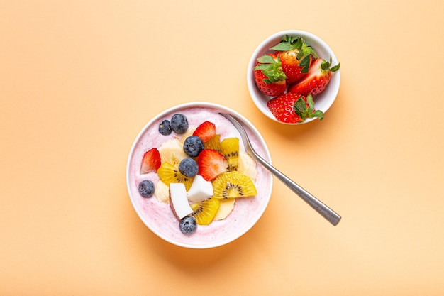 Healthy breakfast or dessert yogurt bowl with fresh banana