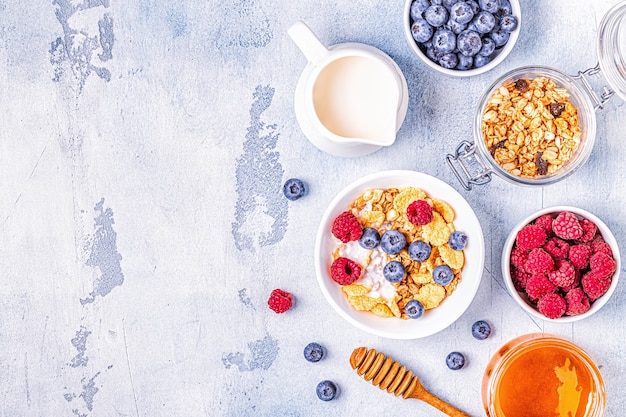 Healthy breakfast, muesli, cereal with fruit, top view.