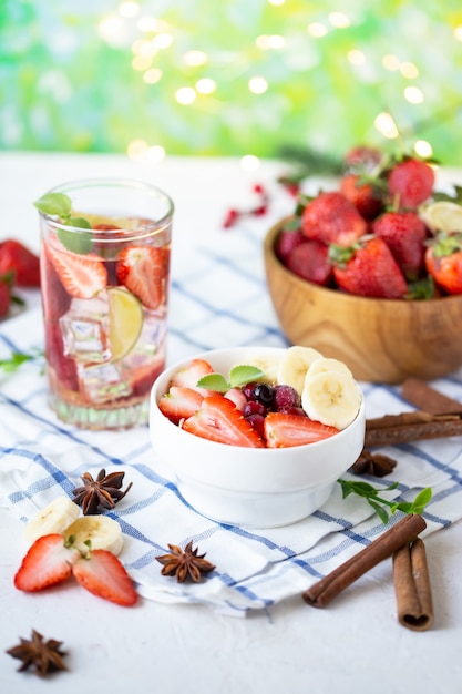 Healthy breakfast muesli with banana strawberries and berries