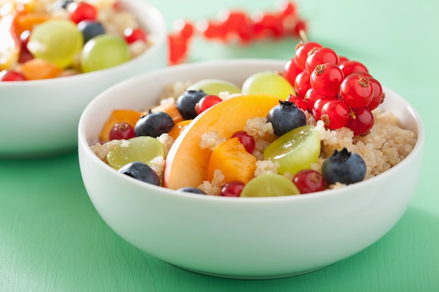 Healthy breakfast quinoa with fruits berry nectarine blueberry grape