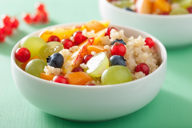 Healthy breakfast quinoa with fruits berry nectarine blueberry grape