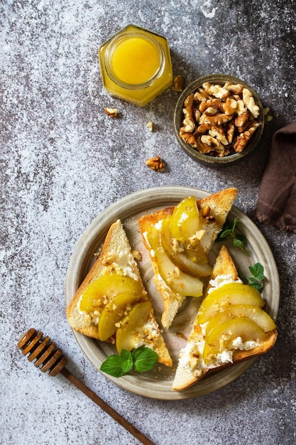 Healthy breakfast or snack antipasto Grill toast with caramelized pear and ricotta Copy space