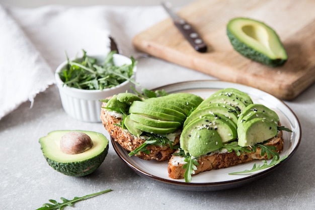 Healthy breakfast with avocado and Delicious wholewheat toast. sliced avocado on toast bread with spices. Mexican cuisine