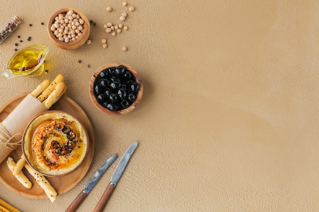 Healthy breakfast with homemade hummus, black olives and crispbread. Diet and Healthy snack food.