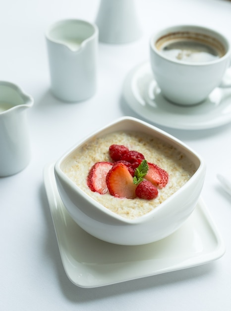 Healthy breakfast with oatmeal porridge and fresh berries. Health and diet.