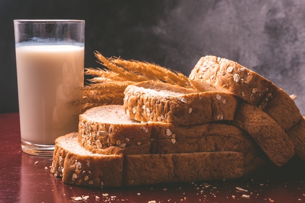 Healthy breakfast with whole wheat bread and milk on the table