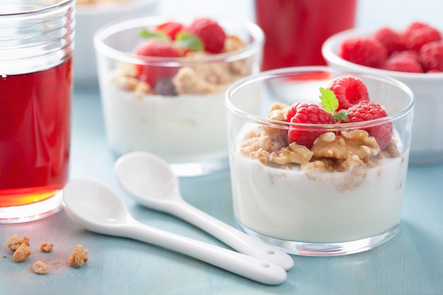 Healthy breakfast with yogurt granola and raspberry