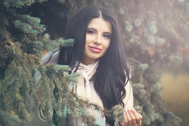 Healthy brunette woman smiling outdoors fashion portrait