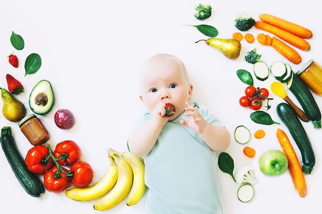 Healthy child nutrition food background Smiling baby 8 months oldBaby first solid feeding