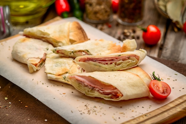 Healthy club sandwich pita bread roll with cheese, ham and parsley