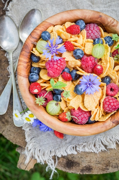 Healthy cornflakes and yogurt decorated with flowers