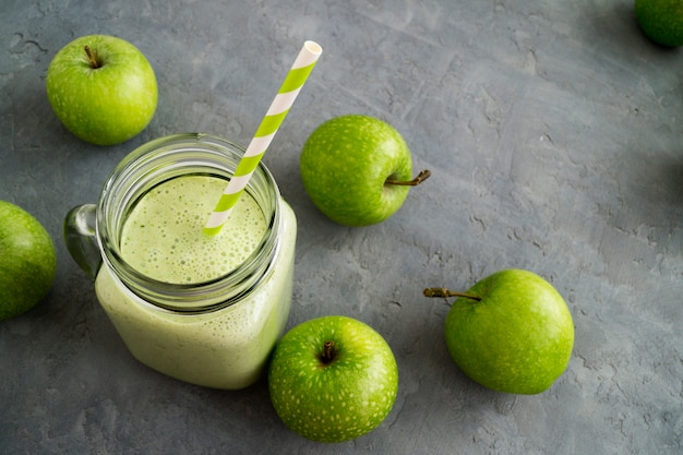 Healthy detox green smoothie in a mason jar.