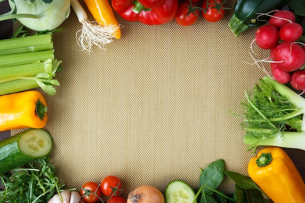 Healthy eating background Different vegetables on golden kitchen placemats