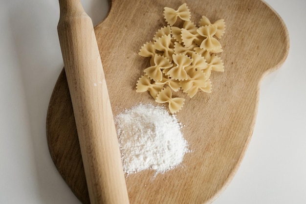 Healthy eating. butterfly paste and rolling pin on a wooden board