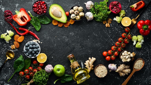 Healthy food background Concept of Healthy Food Fresh Vegetables Nuts and Fruits On a stone background Top view Copy space