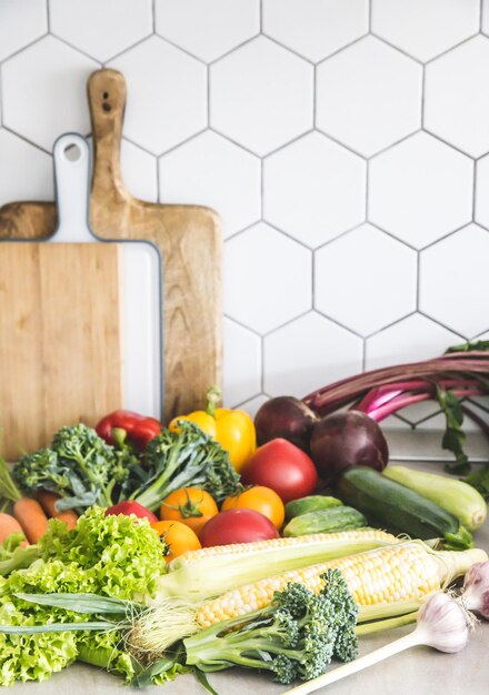 Healthy food background Healthy vegan vegetarian food Fresh raw salad ingredients vegetables tomatoes cucumbers lettuce pepper copy space selective focus