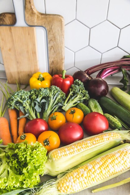 Healthy food background Healthy vegan vegetarian food Fresh raw salad ingredients vegetables tomatoes cucumbers lettuce pepper copy space selective focus